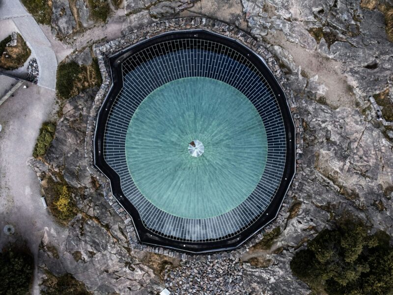 Aerial view of the circular blue roof of the Temppeliaukio Church in Helsinki, Finland