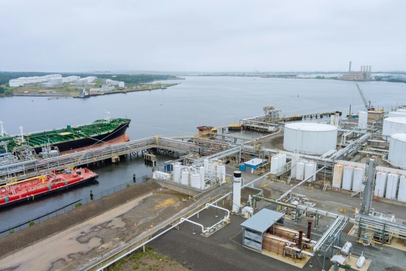 Aerial view transportation crude oil tanker oil storage tank terminal petrol