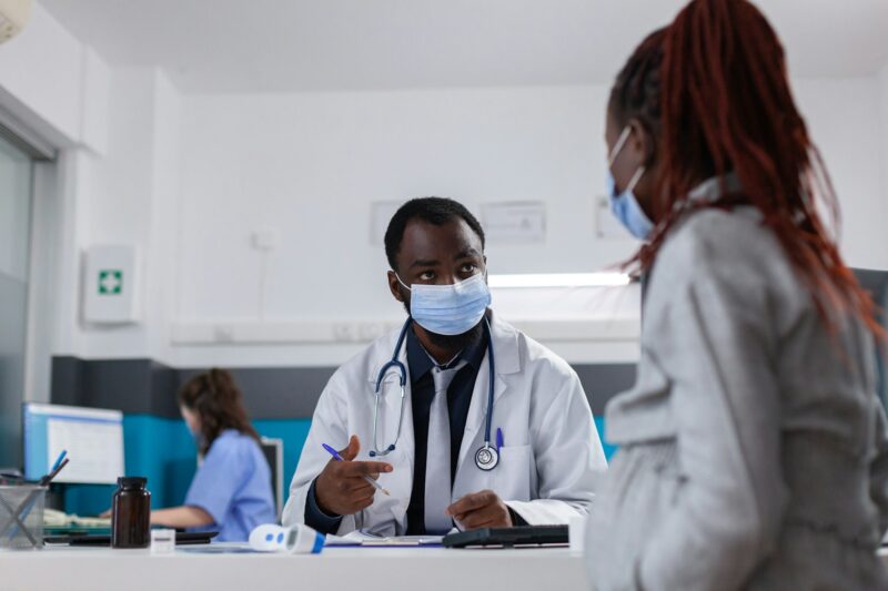 African american doctor and patient at checkup visit