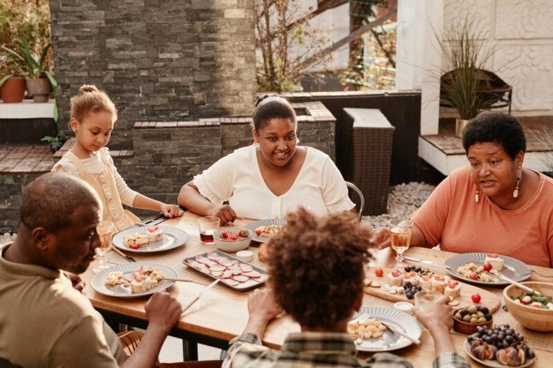 African American Family Dining in Sunlight