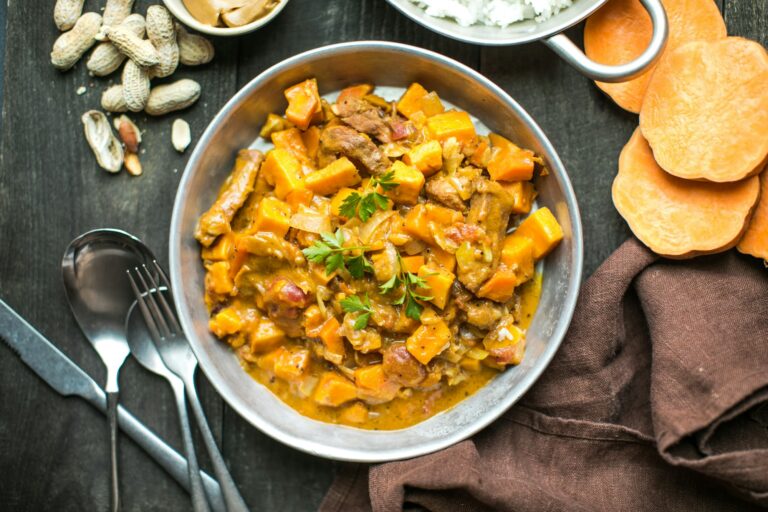 African chicken peanut stew with sweet potatoes with side of basmati rice