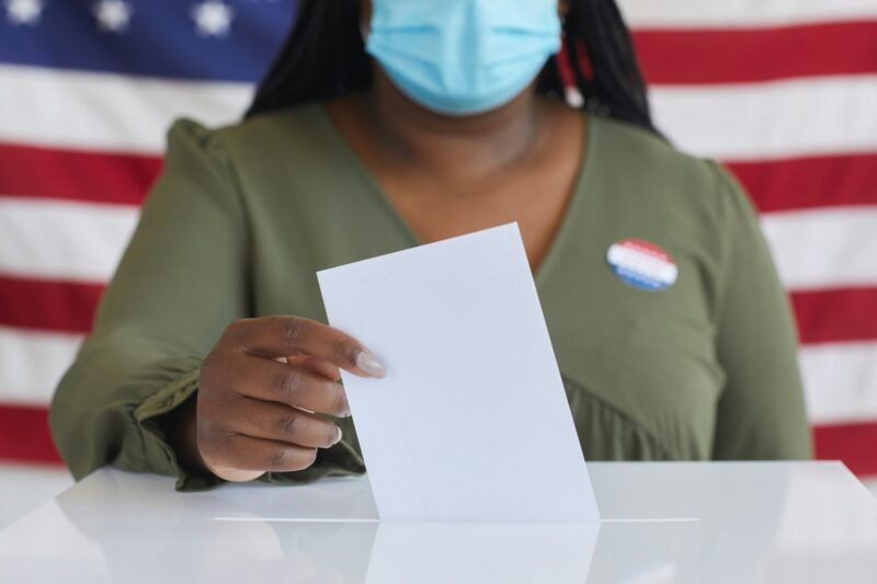 African Woman Voting in Pandemic Close Up