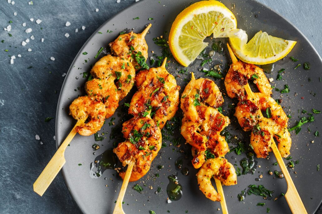 Appetizing prawns served on skewers