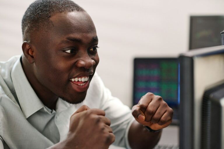 Black Man Enjoying Investment Raise