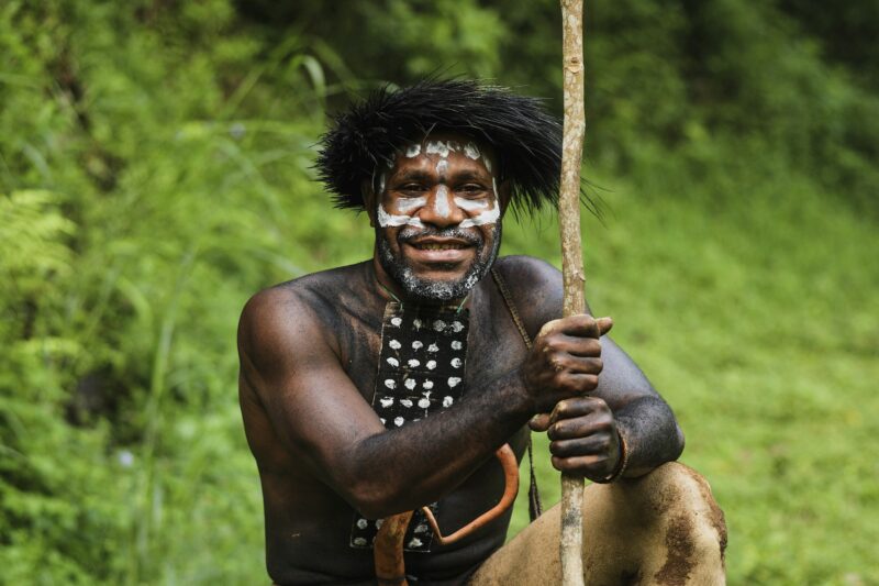 Black man from Papua Indonesia tribe smiling