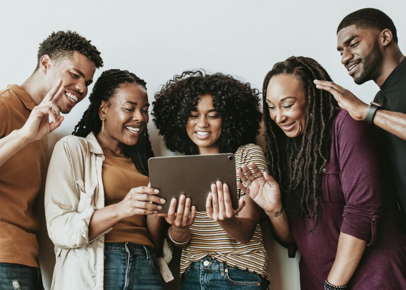 Black people having a video call via a digital tablet