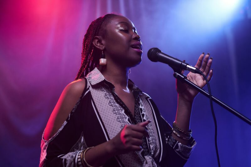 Black Woman Singing in Nightclub