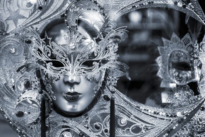 Blue colored picture of traditional carnival mask in Venice, Italy
