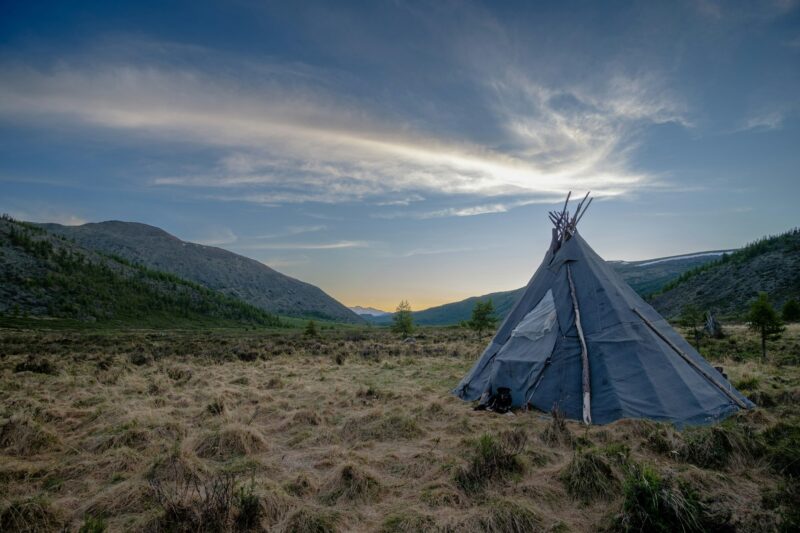 Blue nomadic tribe teepee on a rural field in Mongolia