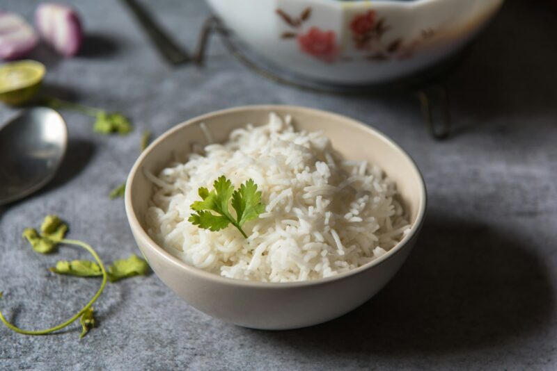 Bowl of rice with coriander leaf