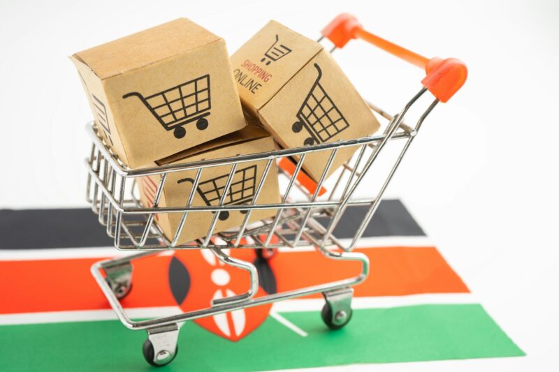 Box with shopping online cart logo and Kenya flag, Import Export Shopping online or commerce finance