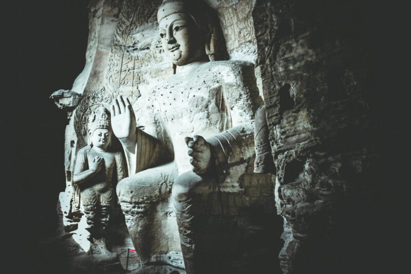 Buddha. Religion and faith. Stone. Sculpture. Cave. Adventure.
