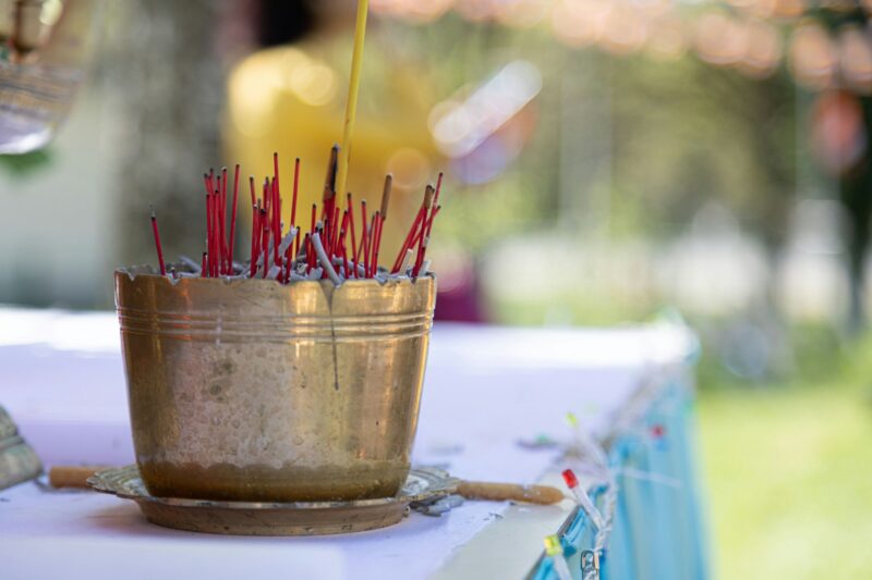 Closeup shot of incense burning at a religious festival