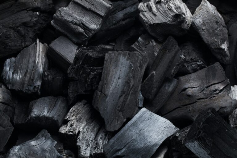 Coal mineral black as a cube stone background