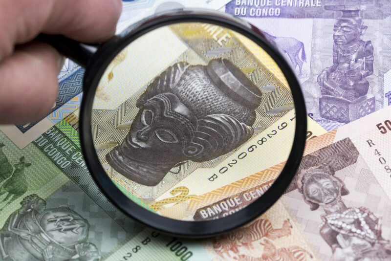 Congolese franc in a magnifying glass