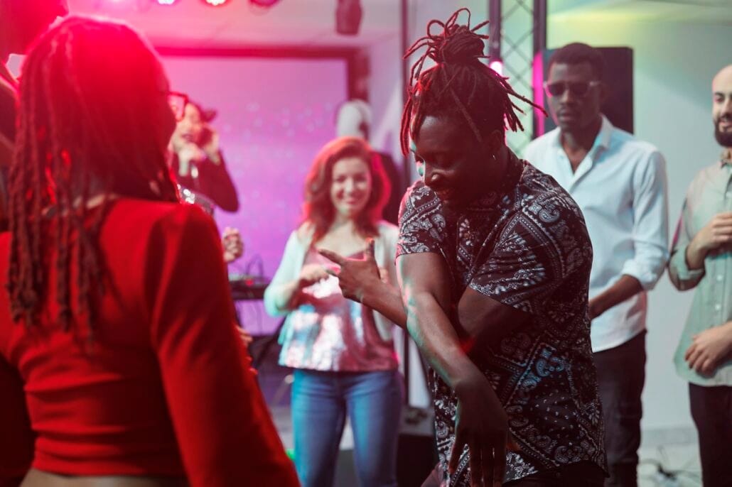 Couple showing moves on club dancefloor