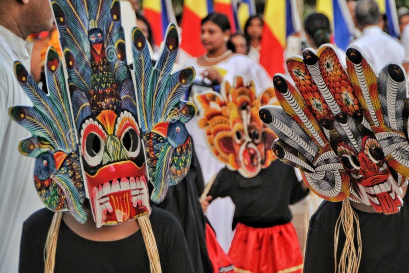 Cultural Parade with children wearing traditional costumes and masks celebrating their heritage