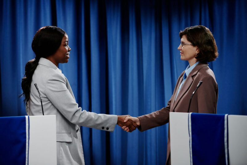 Female political leaders shaking hands