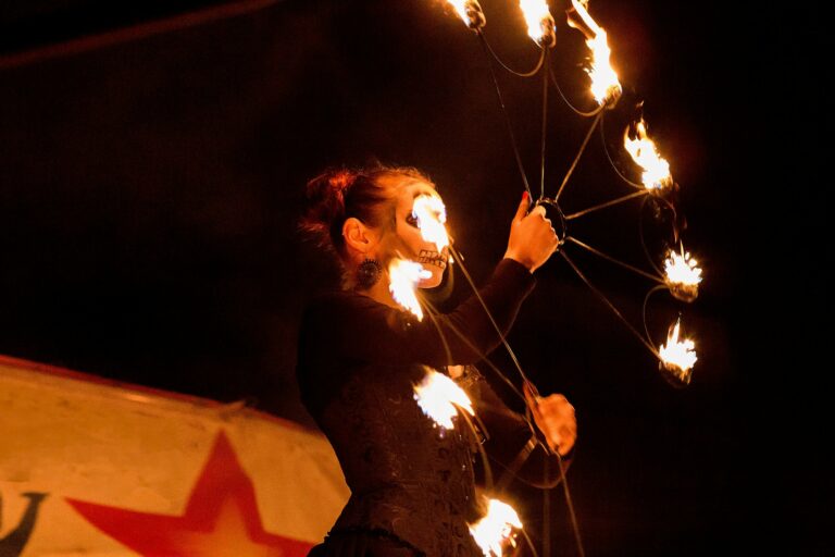 ↟ Fire show. Fire dancer dances. Night performance. Dramatic portrait. Fire and smoke