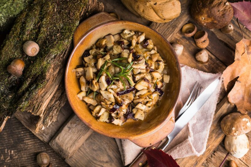 Fried forest mushrooms, boletus, onions. Rustic dish in a frying pan