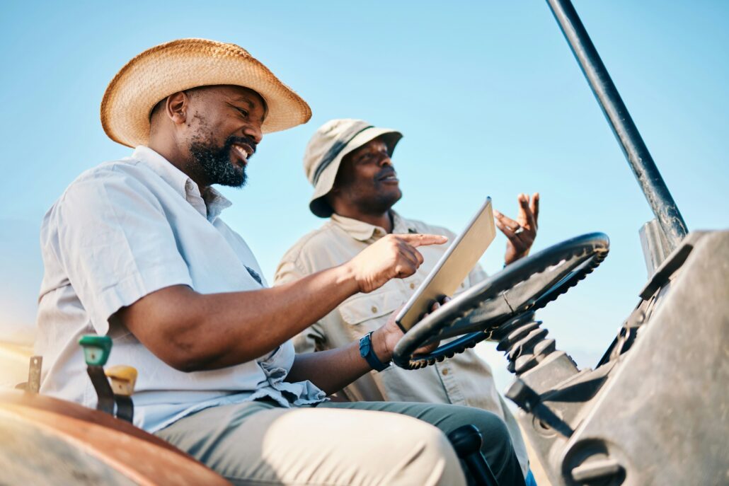 Game drive, safari and men talk with tablet for direction in Kenya desert with car for travel trans
