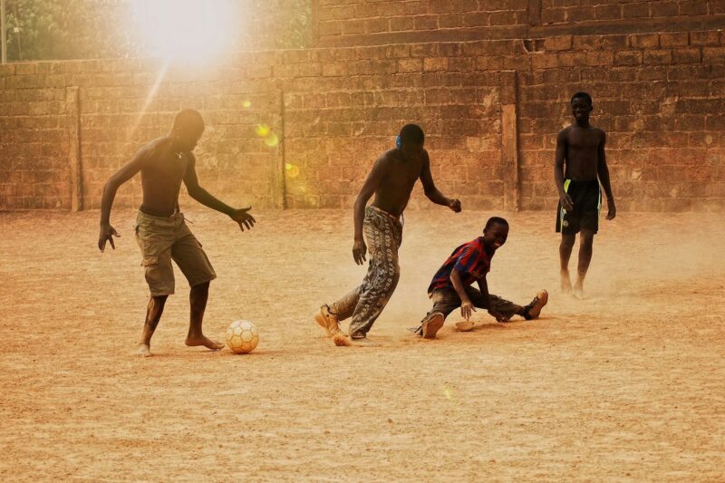 Golden hour - playing football during sunset