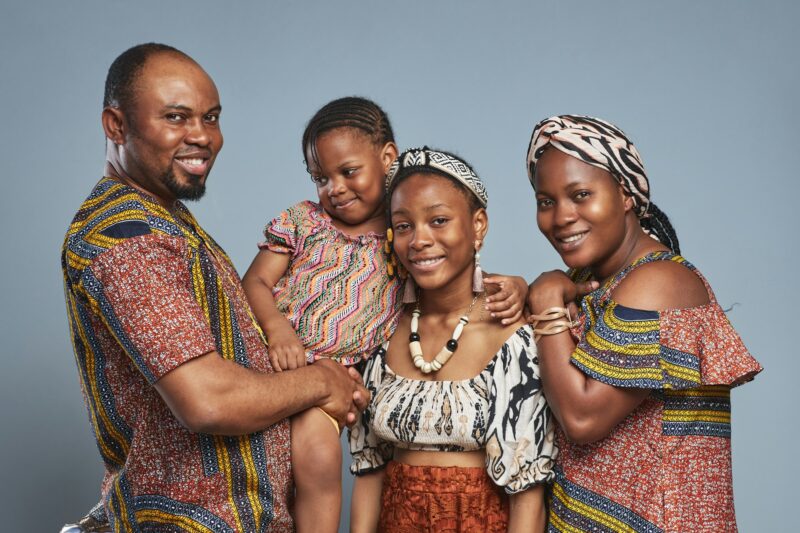 Happy African family of four in national clothing