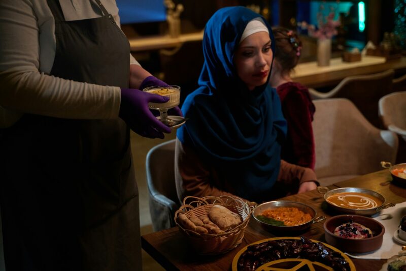 In a heartwarming scene, a professional chef serves an European Muslim family their iftar meal