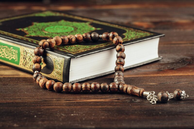 islamic holy book on wooden table