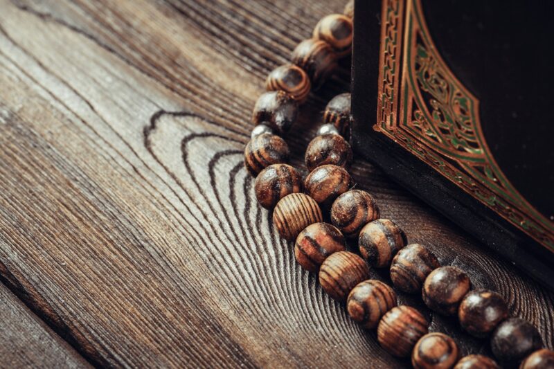 islamic holy book on wooden table. Close up