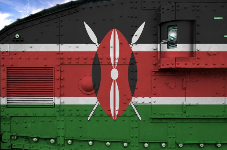 Kenya flag depicted on side part of military armored tank close up