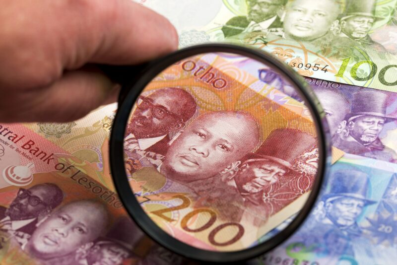 Lesotho money in a magnifying glass