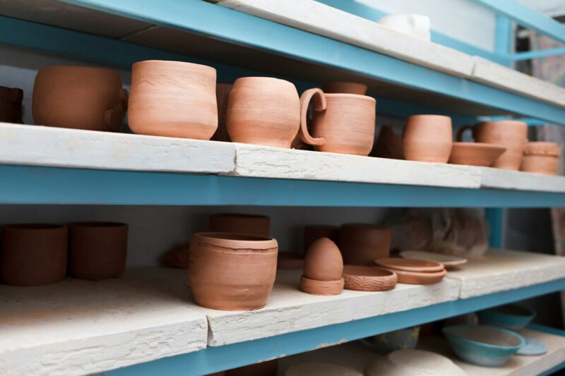 Many different ceramic items on store shelves