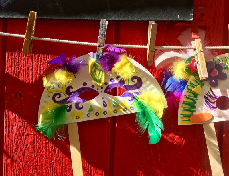 Mardi gras mask made by child in arts and crafts