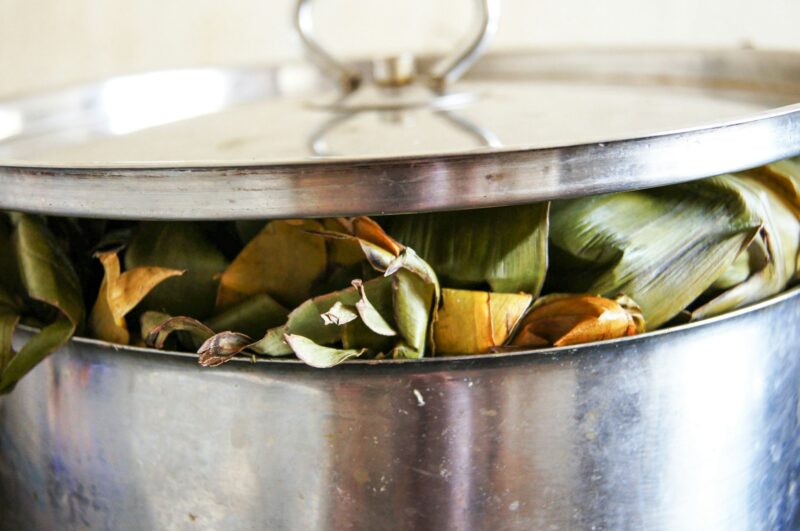 Matoke. African national food. Baked green bananas in leaves.