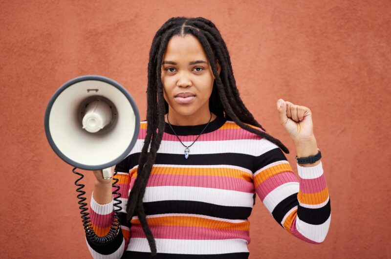 Megaphone, portrait or black woman protest with speech announcement for politics, equality or human