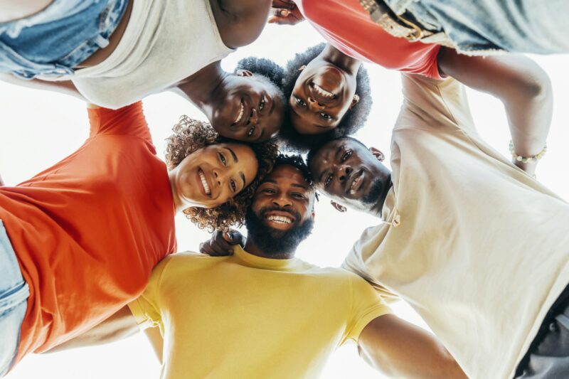 Millennial african people taking selfie in circle together