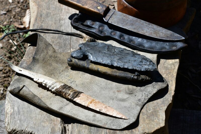 Native American Indigenous people exhibit weapons, knives, jawbone, arrowhead, spearhead