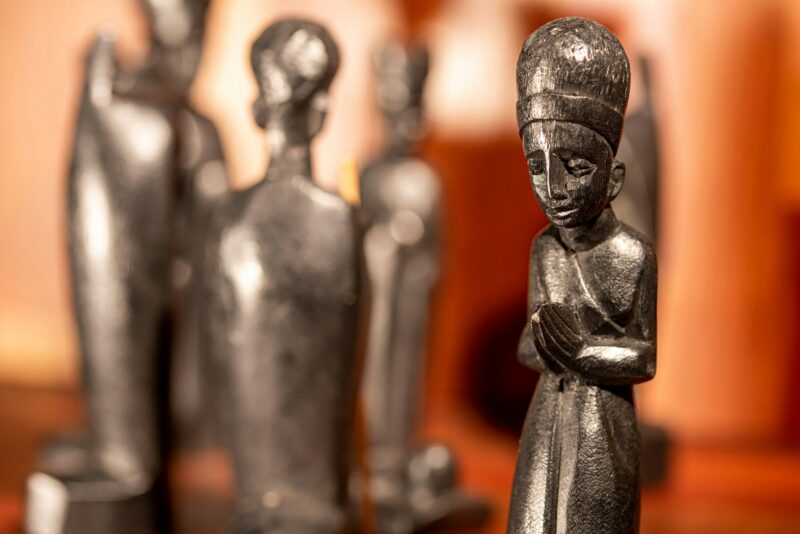 Nativity Scene with African ebony figurines and Mary praying in the foreground