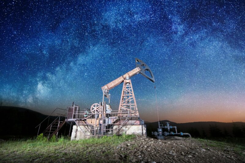 Oil pump on the oil field in the night
