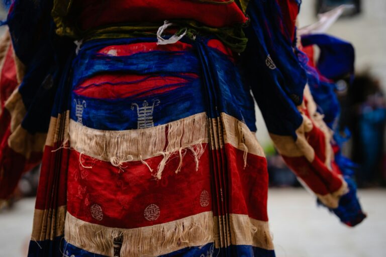 Old colorful cloth of an Ancient Tibetan Buddhist dancer at Tiji festival