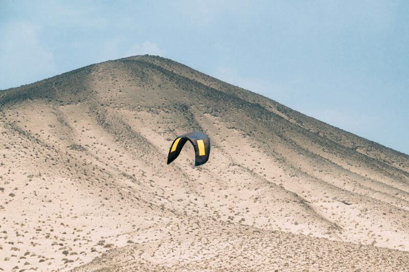 paragliders on sandy terrain