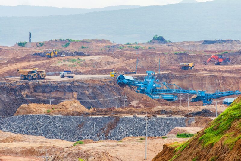 Part of a pit with big mining truck working. Coal mining at an open pit