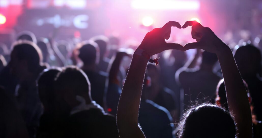 People dancing and cheering at festival