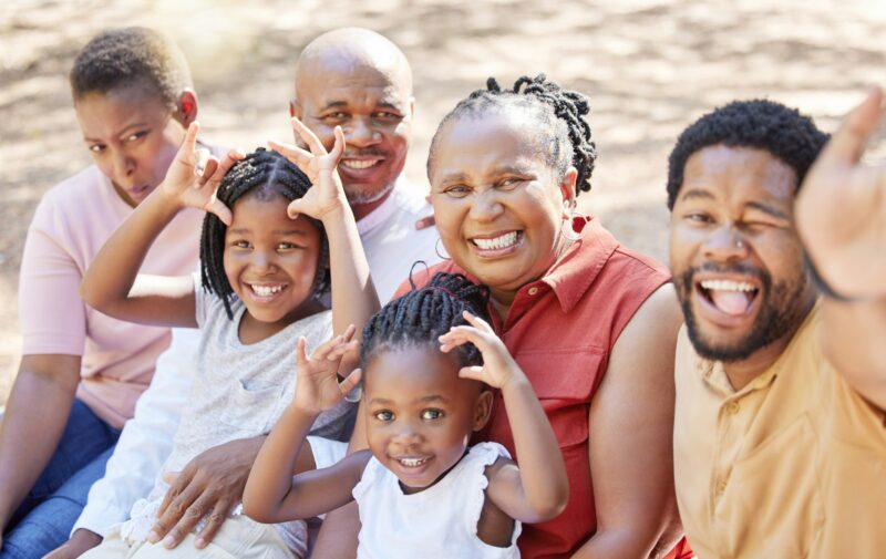 Portrait, happy black family and smile for selfie sitting and bonding in free time together in the
