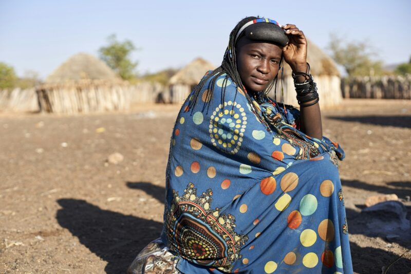 Portrait of a Muhacaona woman in her traditional colorful dress, Oncocua, Angola