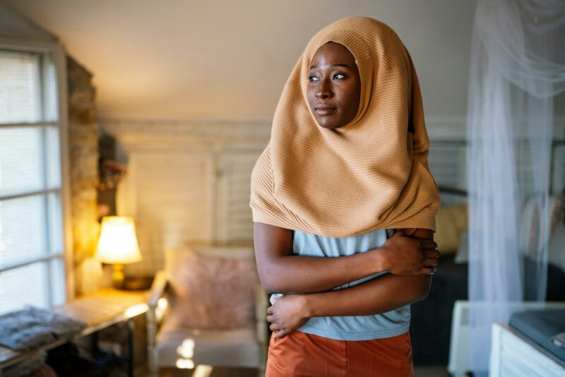 Portrait of beautiful young black african muslim woman wearing headscarf