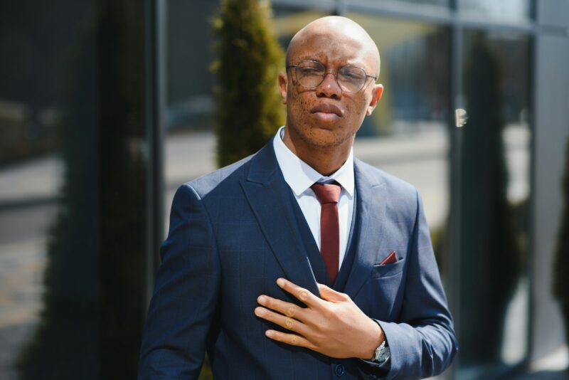 Portrait of confident african businessman standing outdoors