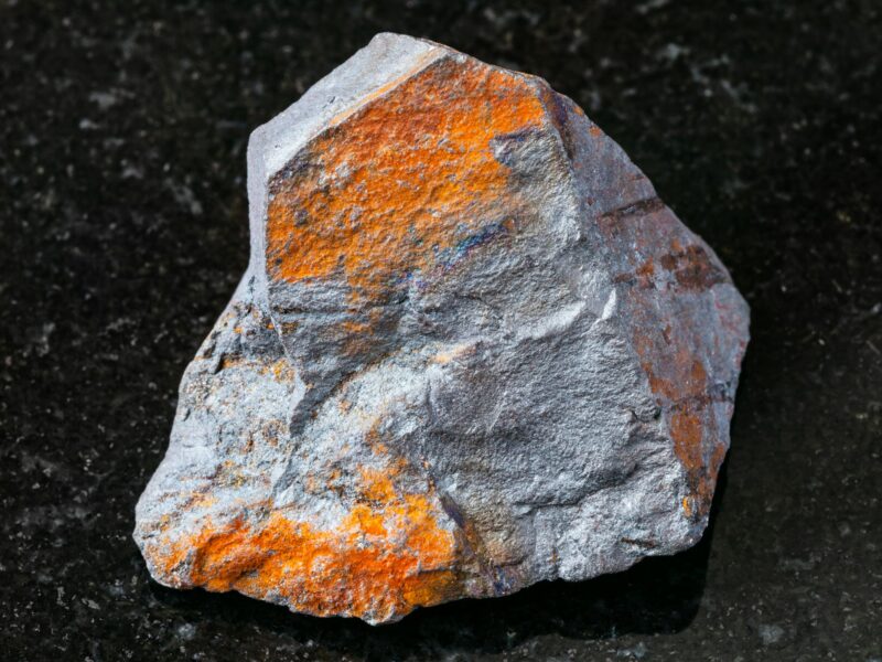 raw Hematite ore on black granite