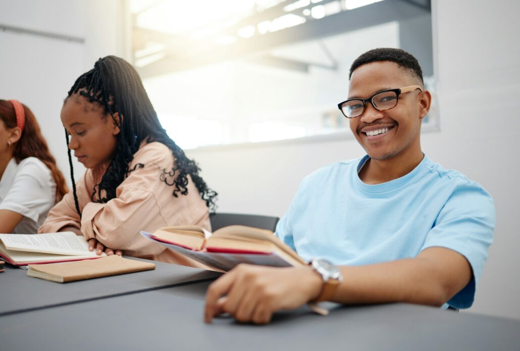 Reading, books and language student portrait studying in classroom for university education, knowle